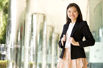 Image showing Young Asian female business executive smiling portrait