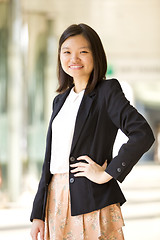 Image showing Young Asian female business executive smiling portrait