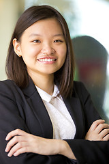 Image showing Young Asian female business executive smiling portrait