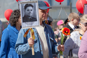 Image showing Man hold a hero portrait