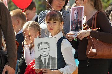 Image showing Girl with a hero portrait