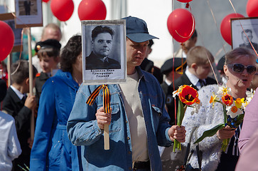 Image showing Man hold a hero portrait