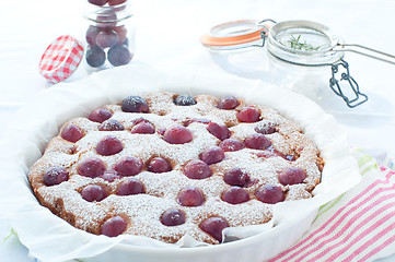 Image showing Fresh cake with red grape season and icing sugar