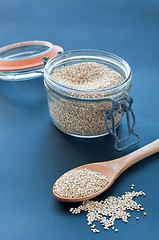 Image showing Filling a glass of quinoa grain from the Andes