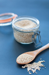 Image showing Filling a glass of quinoa grain from the Andes