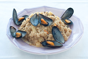 Image showing Warm quinoa salad with mussels, tomatoes and potatoes