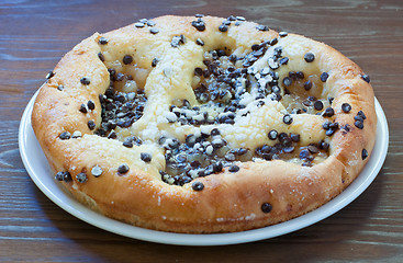 Image showing Sweet cake with chocolate chunks, cheese and powdered sugar