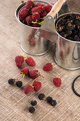 Image showing Metal buckets with fresh berries