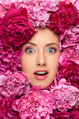 Image showing Woman face in peony flowers