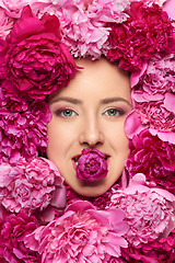 Image showing Woman face in peony flowers