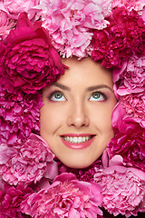 Image showing Beautiful girl with pink peony flowers