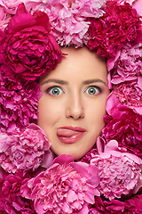 Image showing Woman face in peony flowers
