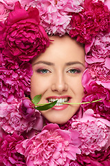 Image showing Woman face in peony flowers