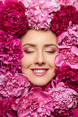 Image showing Woman face in peony flowers