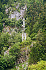 Image showing hillside power pole