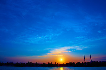 Image showing factory in silhouette and sunrise sky