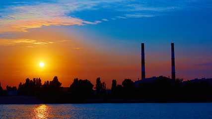 Image showing factory in silhouette and sunrise sky