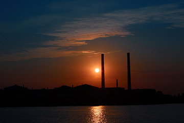 Image showing factory in silhouette and sunrise sky