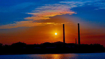 Image showing factory in silhouette and sunrise sky