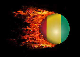 Image showing Flag with a trail of fire - Guinea