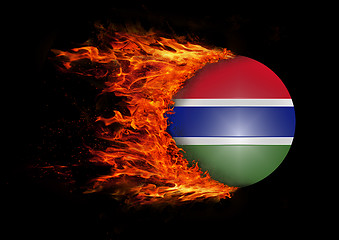 Image showing Flag with a trail of fire - Gambia