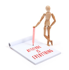 Image showing Wooden mannequin writing - Attitude is everything