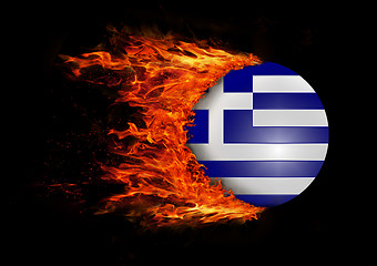 Image showing Flag with a trail of fire - Greece