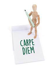 Image showing Wooden mannequin writing - Carpe diem