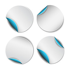 Image showing Set of white round stickers with blue backside.