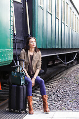 Image showing beautiful middle-aged woman traveling in a retro style