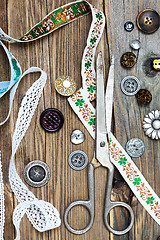 Image showing Old scissors, old lace and vintage buttons