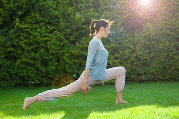 Image showing Pretty adult woman doing yoga exercises