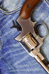 Image showing Nagan revolver on blue jeans