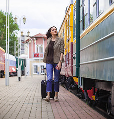 Image showing beautiful middle-aged woman with a suitcase