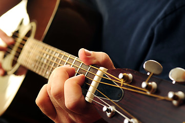 Image showing Man playing a guitar