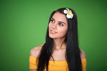 Image showing Teen female with Plumeria Flower