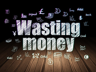 Image showing Currency concept: Wasting Money in grunge dark room