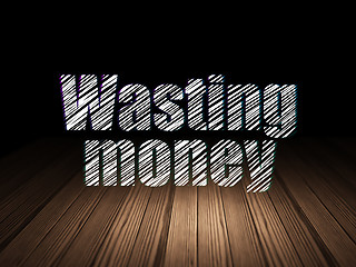 Image showing Money concept: Wasting Money in grunge dark room