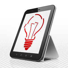 Image showing Finance concept: Tablet Computer with Light Bulb on display