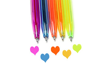 Image showing Bright colorful pens and abstract hearts 