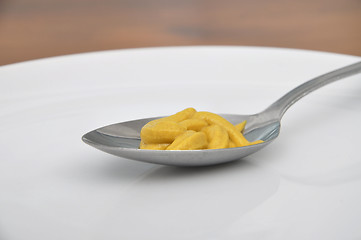 Image showing Spoon with mustard