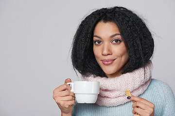 Image showing Smiling winter woman with cup of coffee