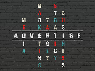 Image showing Marketing concept: word Advertise in solving Crossword Puzzle