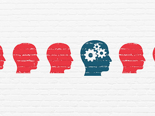 Image showing Studying concept: head with gears icon on wall background