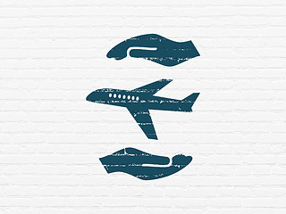 Image showing Insurance concept: Airplane And Palm on wall background