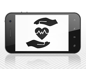 Image showing Insurance concept: Smartphone with Heart And Palm on display