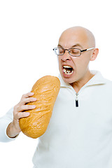 Image showing man biting a loaf. Isolated on white