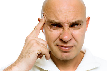 Image showing man holding his finger to his temple. Headache or problem