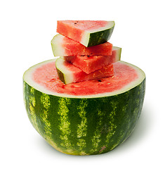 Image showing Half of watermelon and slices on top