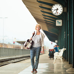 Image showing Lady waiting at the railway station.